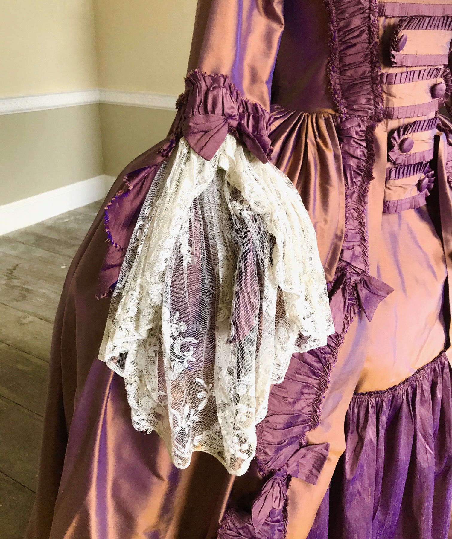 An exceptional lady's 18th century style sack dress, bronze and purple with fine lace cuffs - with skirt and pannier frame. Ex London Festival Opera 'The Magic Flute'.